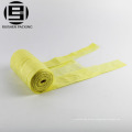 Yellow colored t-shirt rolling trash bags for car